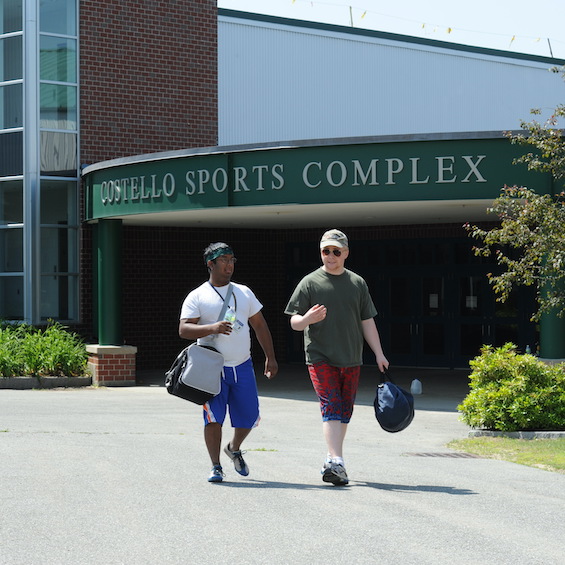 Two students walk out of the Costello Sports Complex.