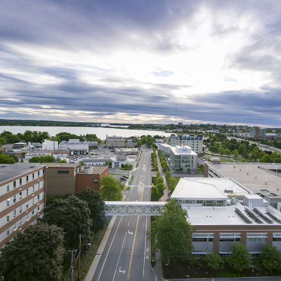 An aerial view of the USM Portland campus, with the sun breaking through the clouds.