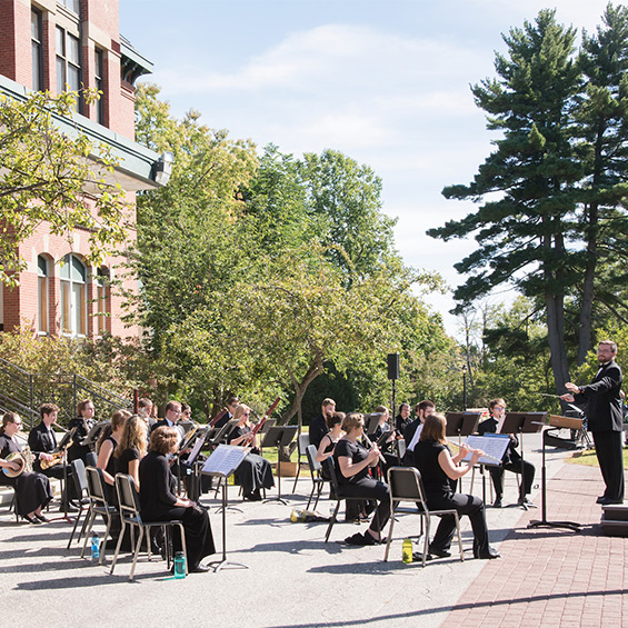 Students perform outside of Corthell Hall at the Annual Outdoor Band Concert.