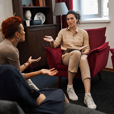 A counselor has an individual session with a patient.