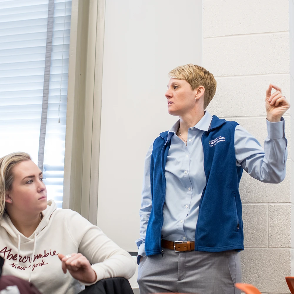 USM School of Business Associate Professor Heidi Parker talks to students during class.