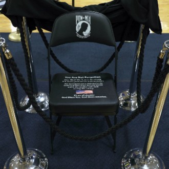 A seat at Hill Gymnasium will remain empty in memory of troops held as prisoners of war or declared missing in action.