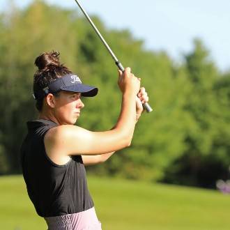 Mackenzie Kingsbury watches the arch of her drive during a practice round at Riverside Golf Course in Portland.