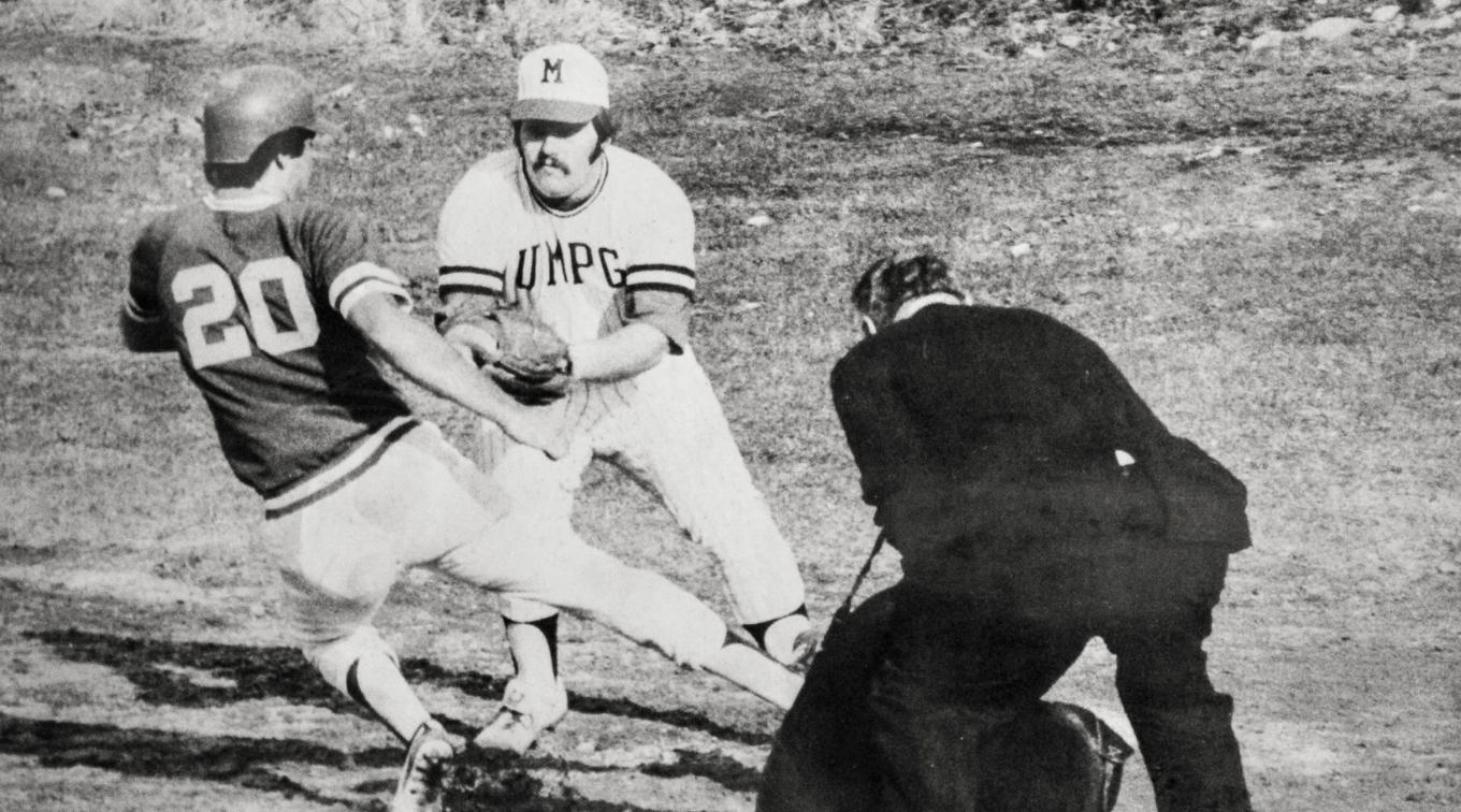 Al Bean playing college baseball - black and white image.