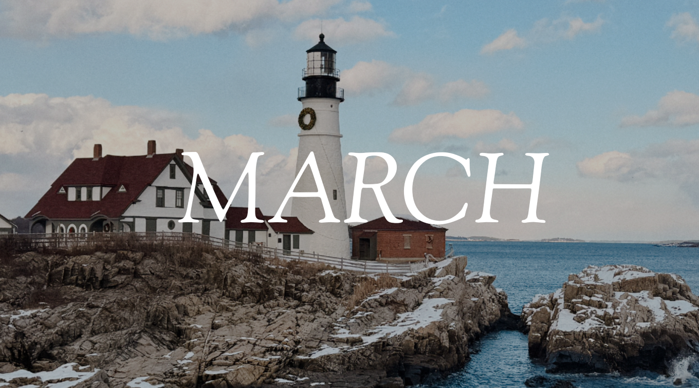 Portland Head Light lighthouse is covered in snow and surrounded by snowy rocks above the ocean. The word "March" overlays the image