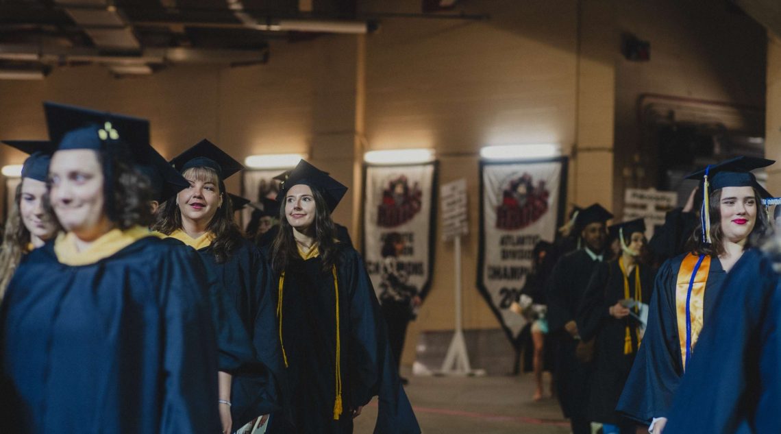 Students line up in their designated areas ahead of commencement.