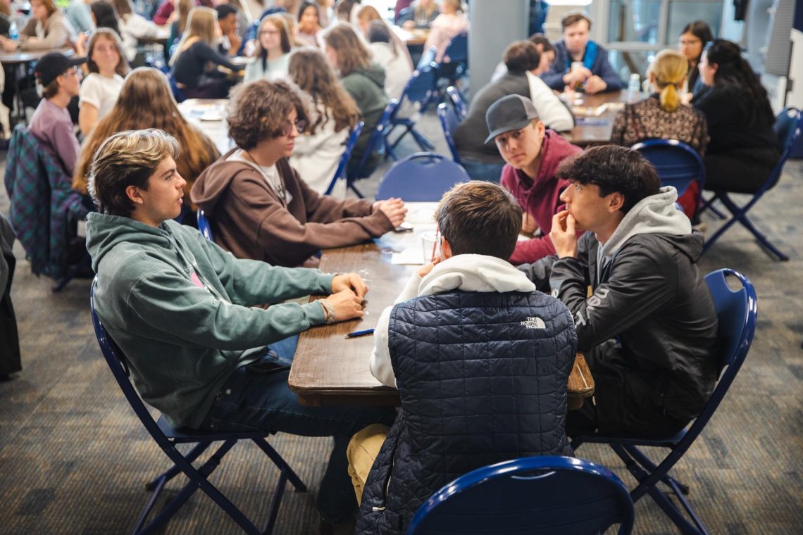 Admitted students sit together at a table during USM's Admitted Students Day