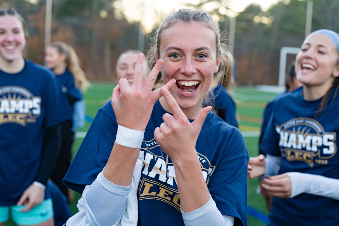 Bridgette Toland smiling and holding up three fingers to celebrate three wins.