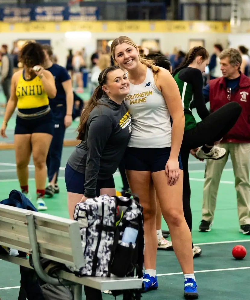 Asman and Barnes at a track and field meet.