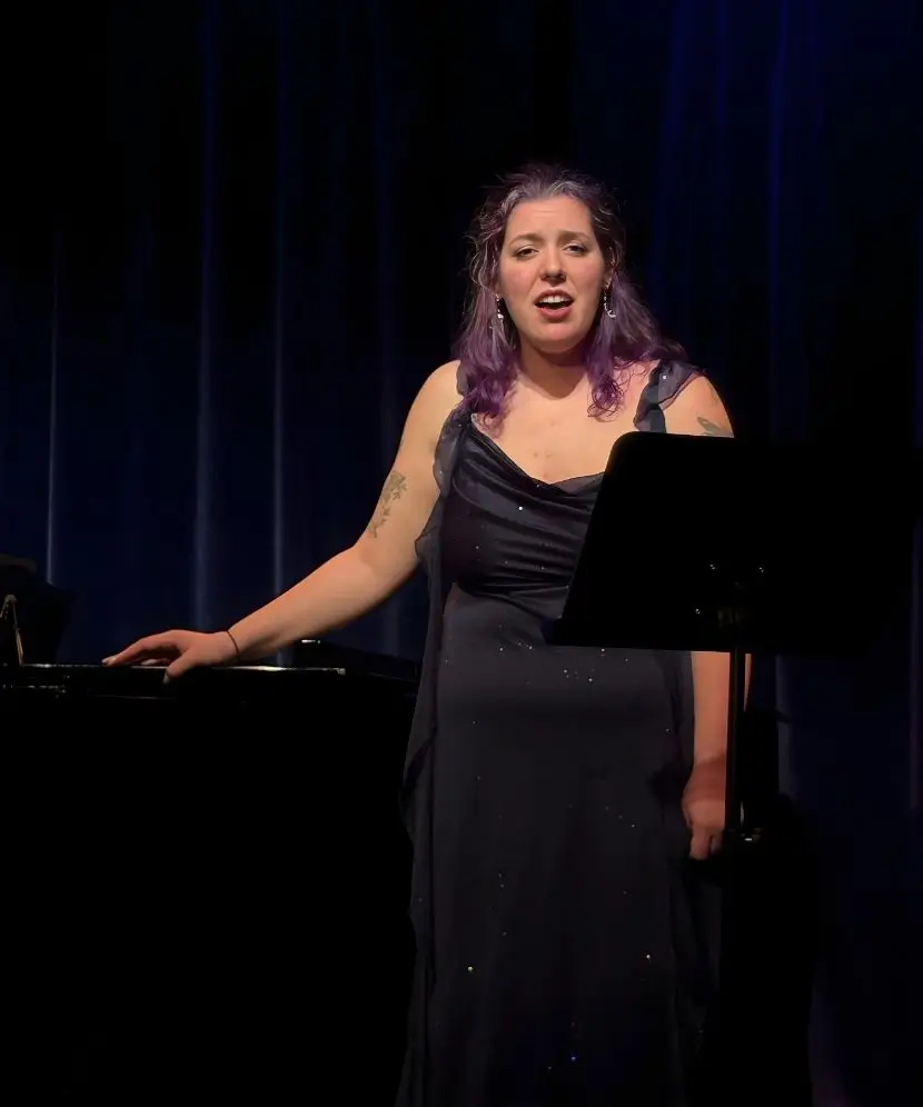 Lizzy Fogg singing abroad on an international research trip.