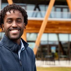 Business analytics student Mohamed Ali on the Bean Green in front of the McGoldrick Center.