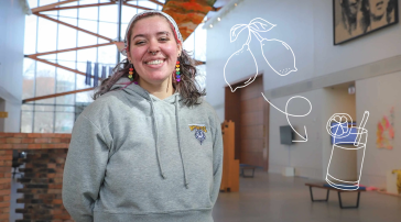 A USM student smiles in a campus common area wearing a Huskies hoodie, with an illustrated lemon and iced lemondade graphic overlaid on the image.