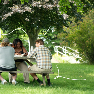 Students study together at a picnic table, surrounded by illustrated doodles.