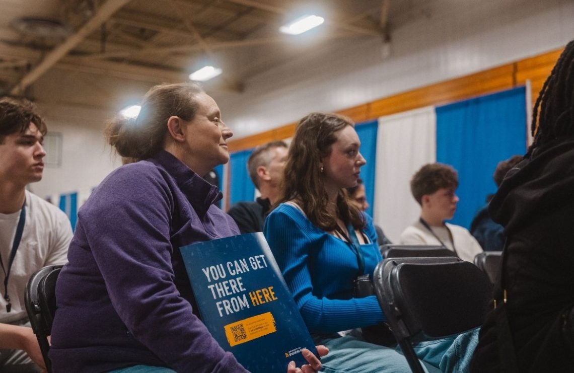 Newly admitted student with parent at Admitted Students Day.