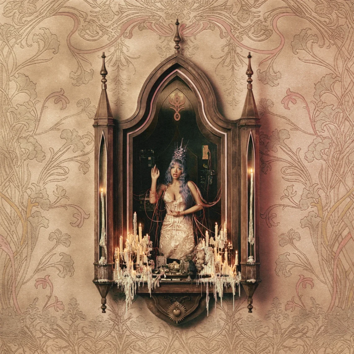 Album artwork featuring Melanie Martinez inside an ornate Gothic mirror frame surrounded by candles, set against a vintage wallpaper backdrop.