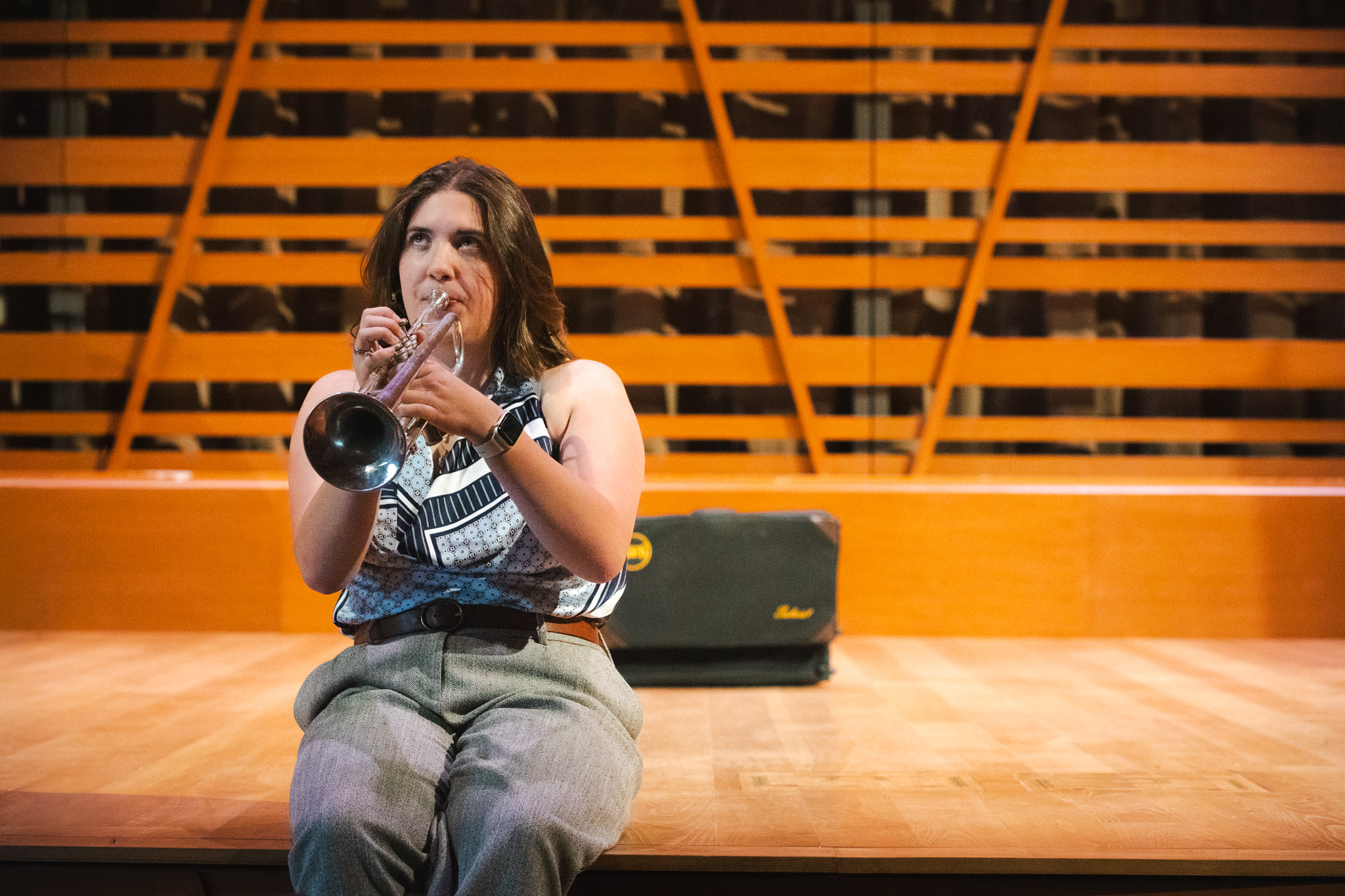 Hannah Paterson plays trumpet on the Crewe Center's stage.