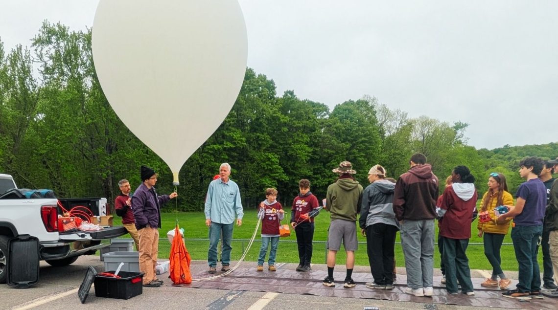 Students prepare to launch a research balloon to the edge of space.