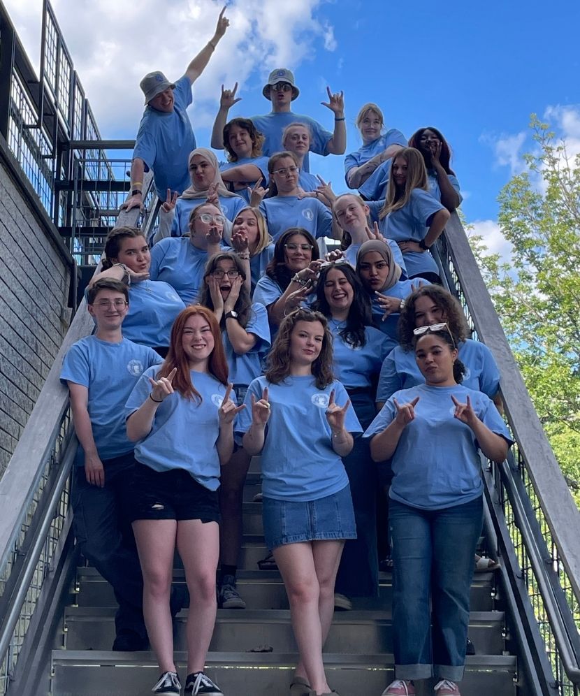 2025 Orientation Leaders posed on steps.