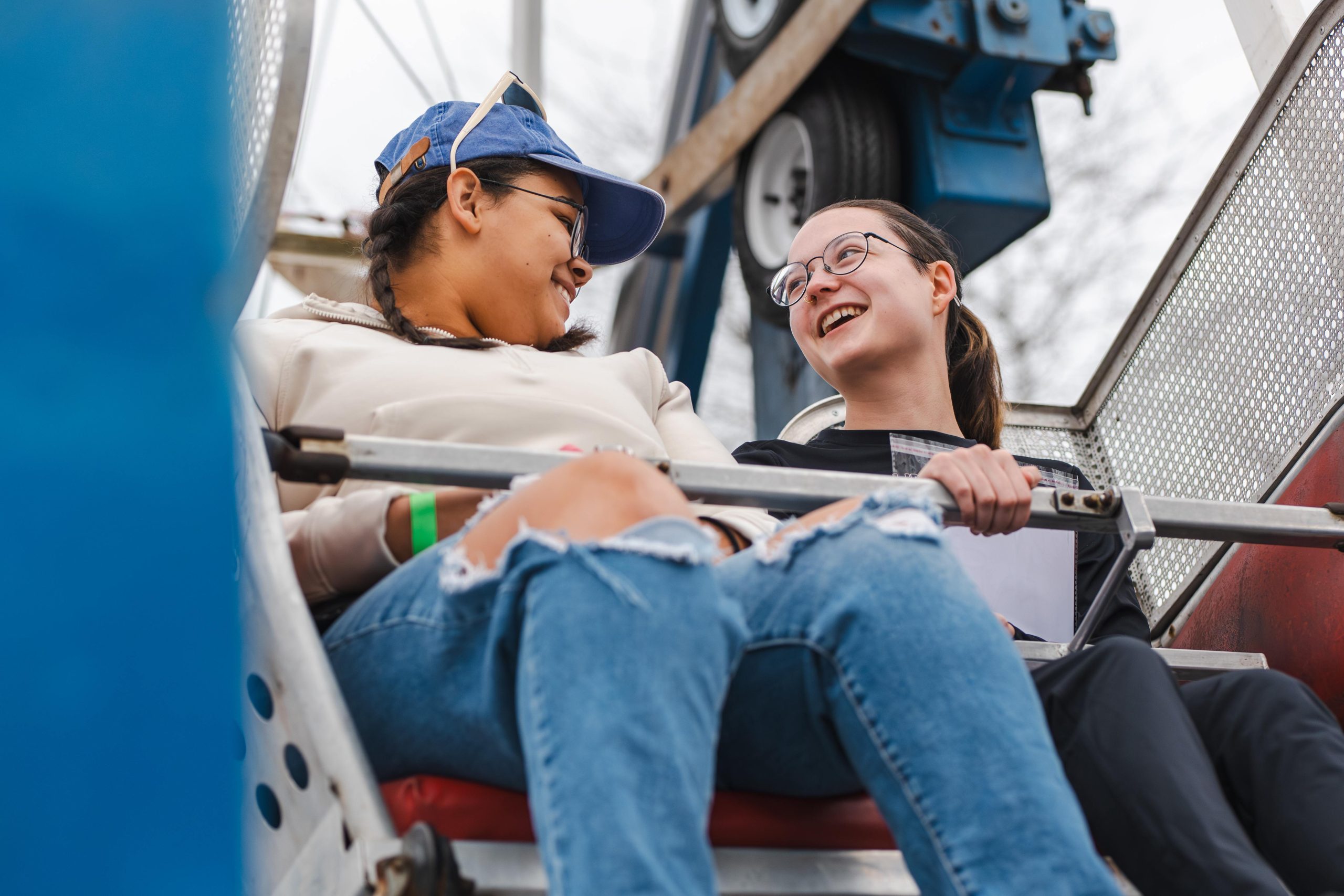 Two USM students laugh together while riding a Ferris wheel at Spring Fling.