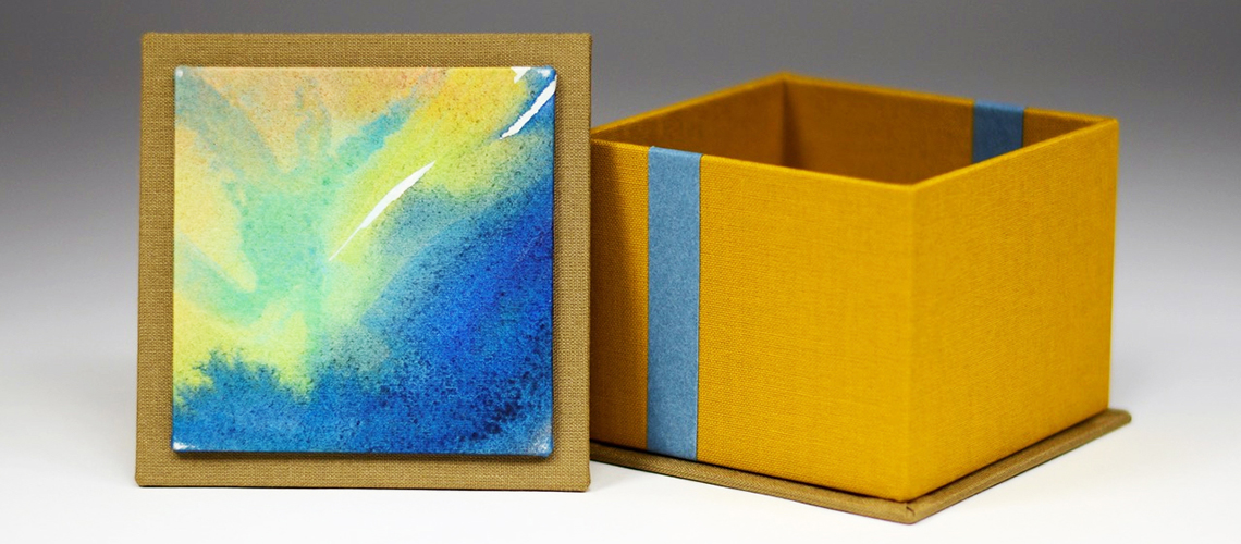 Handmade covered box with lid off decorated with watercolor by Joelle Webber