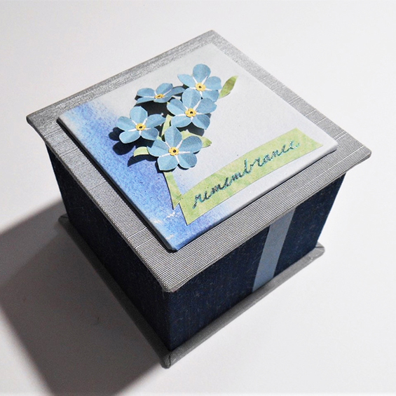 Handmade covered box decorated with blue paper flowers by Joelle Webber