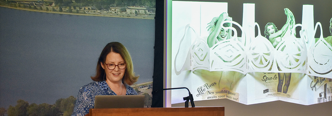 Image of Christine Ahlstrin presenting lecture and slide-show on her artist's books.