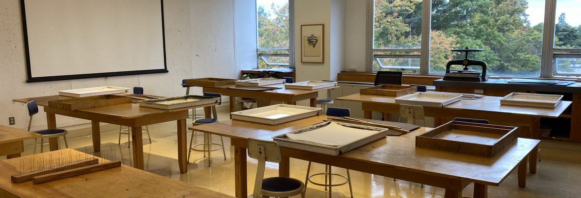 Photograph of an empty classroom full of bookmaking tools for future projects.