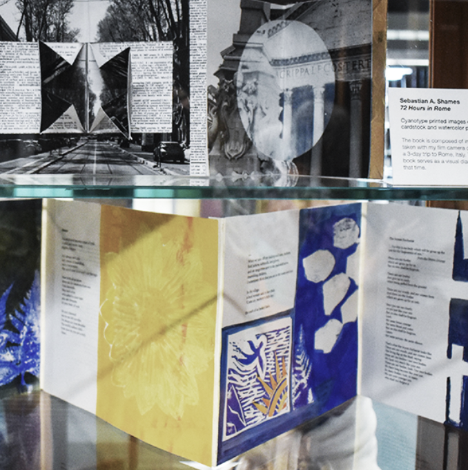 Image of Artist Books in glass display case at the Pope Cheney Art Studio.
