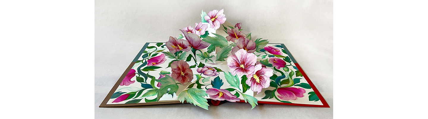 A pop up book with roses
