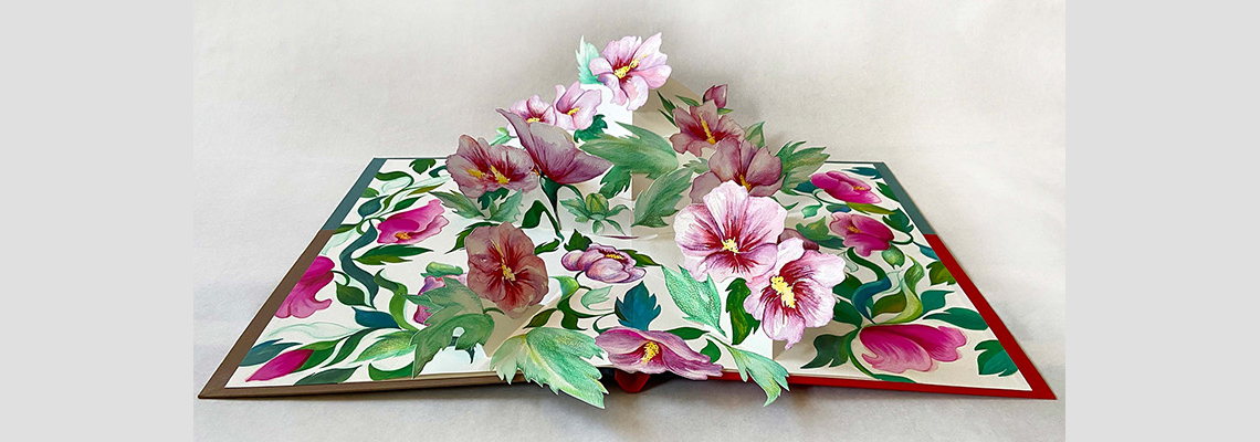 An image of a pop-up book with roses.