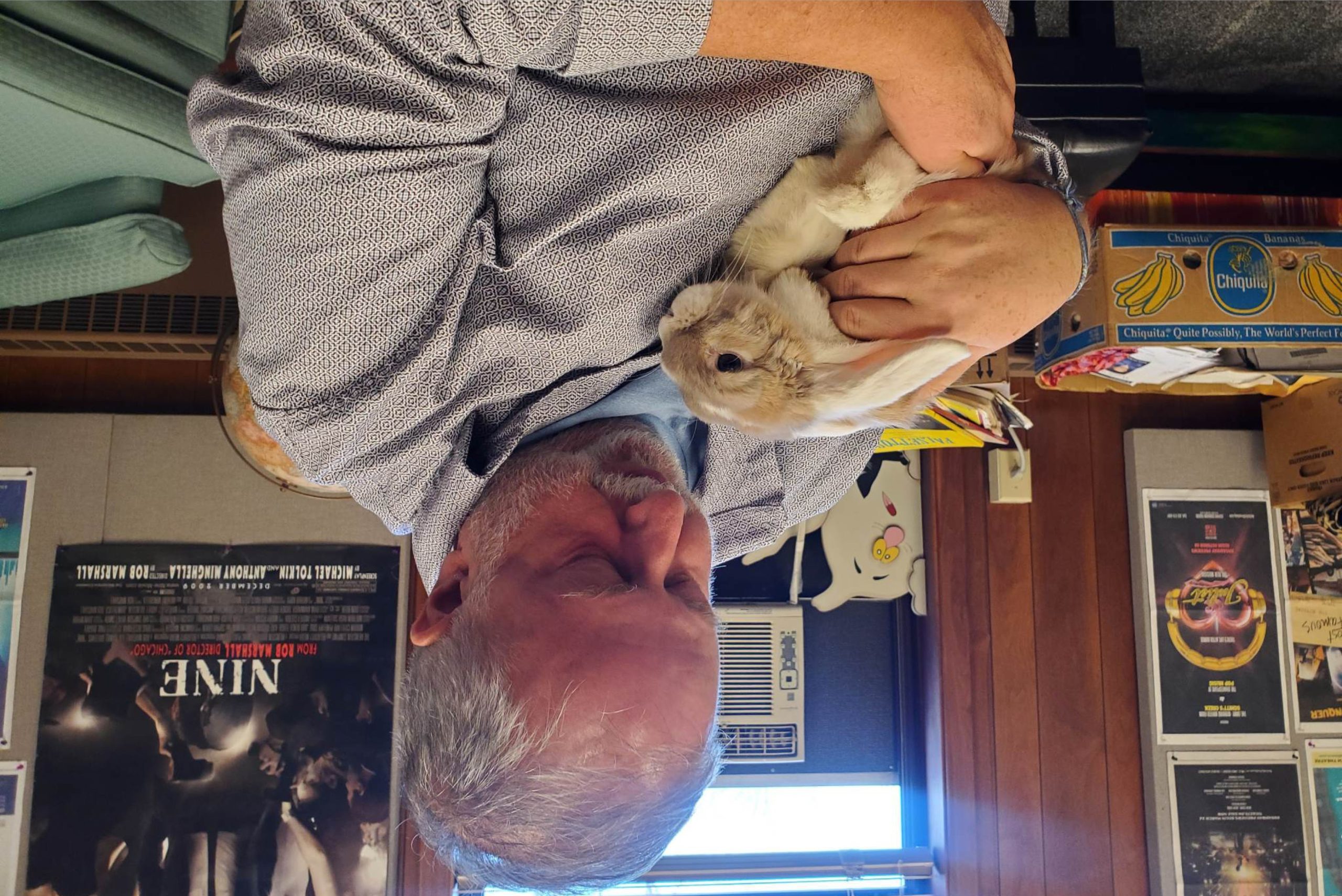 Ed Reichert and his rabbit, S'More, upside down in observance of April Fool's Day.