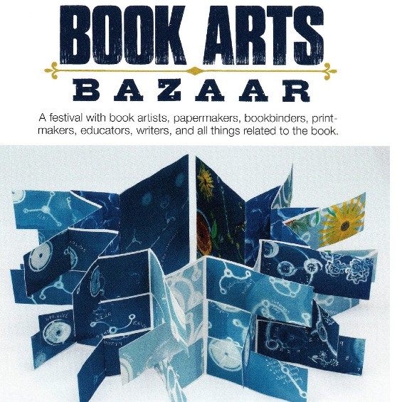 Book Arts Bazaar graphic with blue fold out book with white and yellow designs. Book makes a large star when fully open
