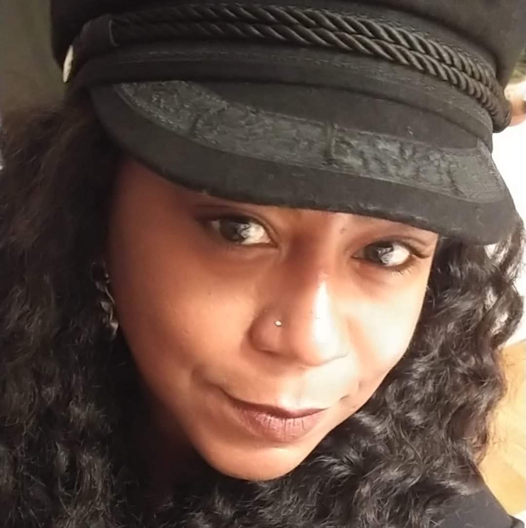Headshot of Shay Stewart-Bouley, a Black women wearing her hair down and a black hat