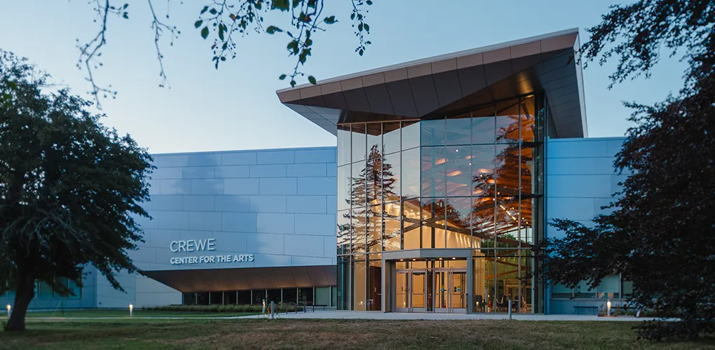 The Crewe Center at dusk reflecting summer foliage.