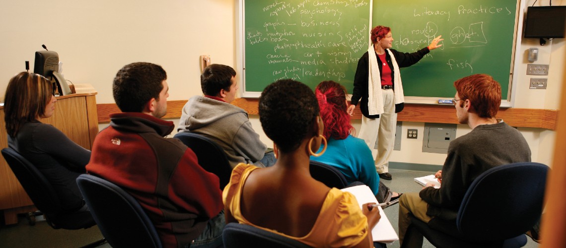 People in classroom with instructor at front