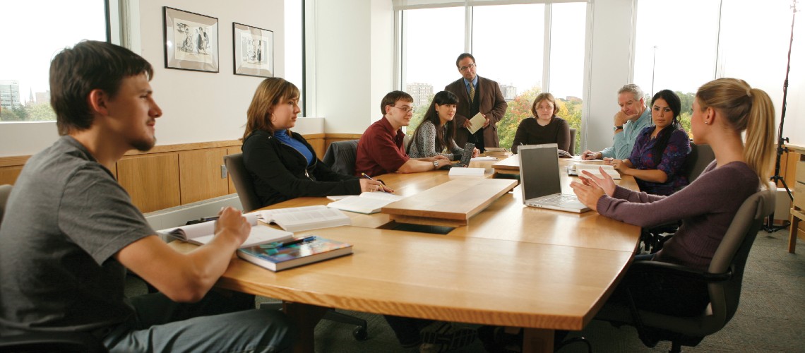 People sitting around conference room table