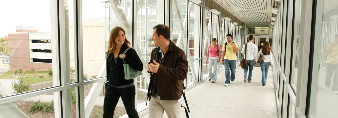 Students walking through the skywalk on the Portland campus.