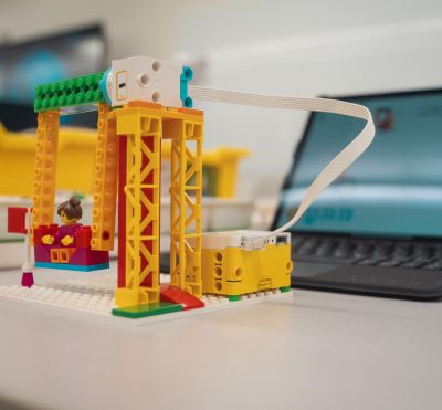 a swing created from a programmable LEGO set 
