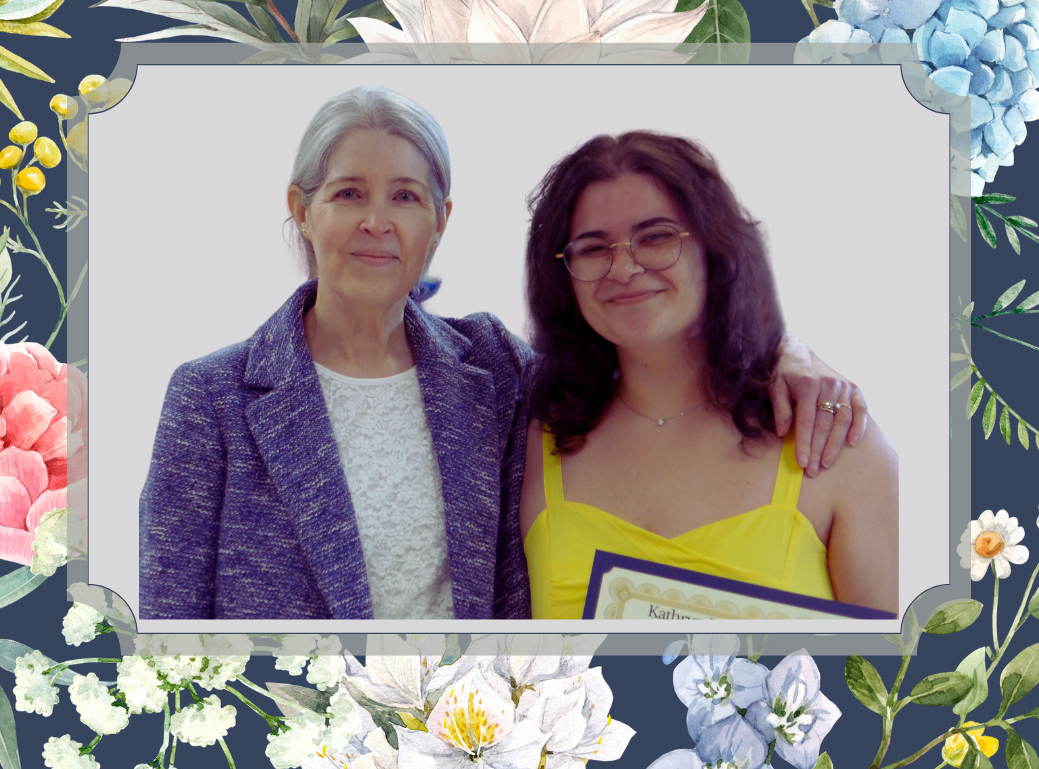 Professor Ebben stands beside Kelly, the Kathryn Lasky Award winning student. Kelly holds the award.