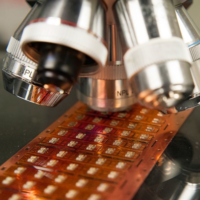Microscope examining a circuit board for analysis and quality inspection