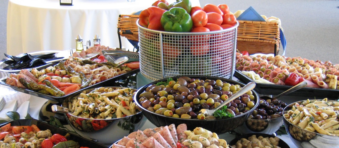 A catering display featuring mediterranean style foods.