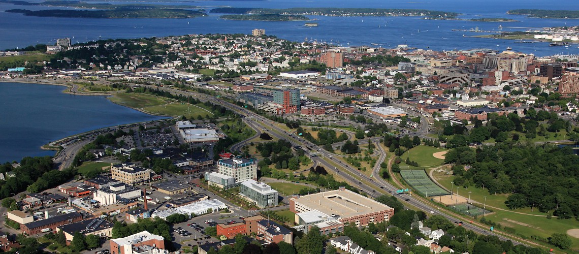 An aerial shot of our Portland Campus with the Portland Peninsula and Casco Bay in the background.