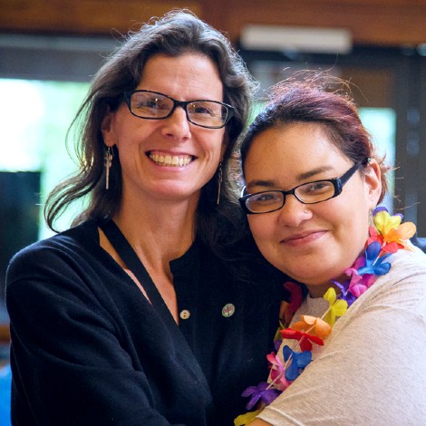 Two smiling women at a Teen Conference