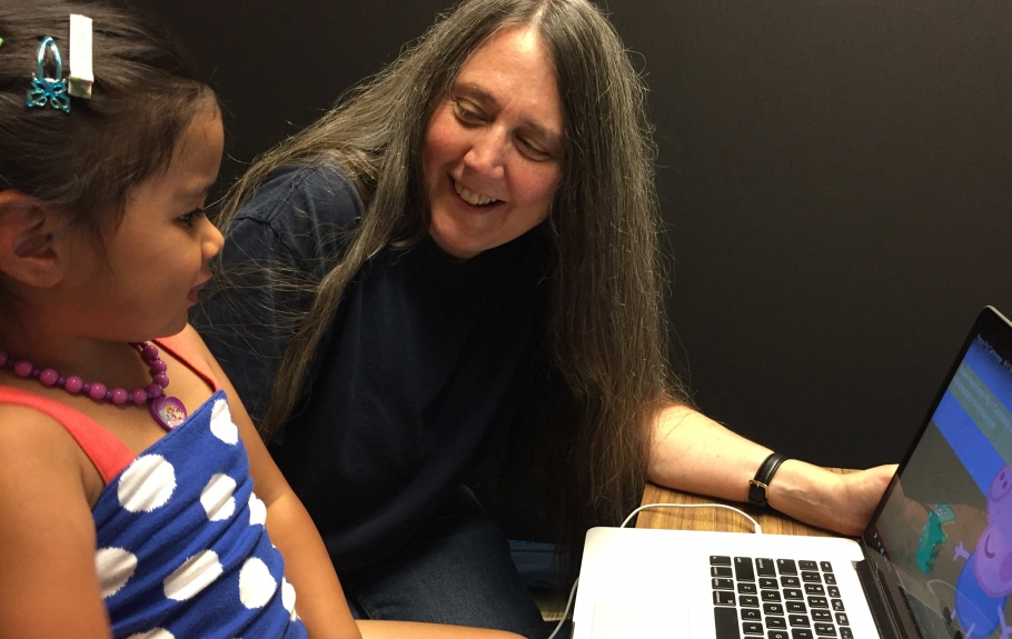 Prof. Dana McDaniel with a child in a language acquisition study.