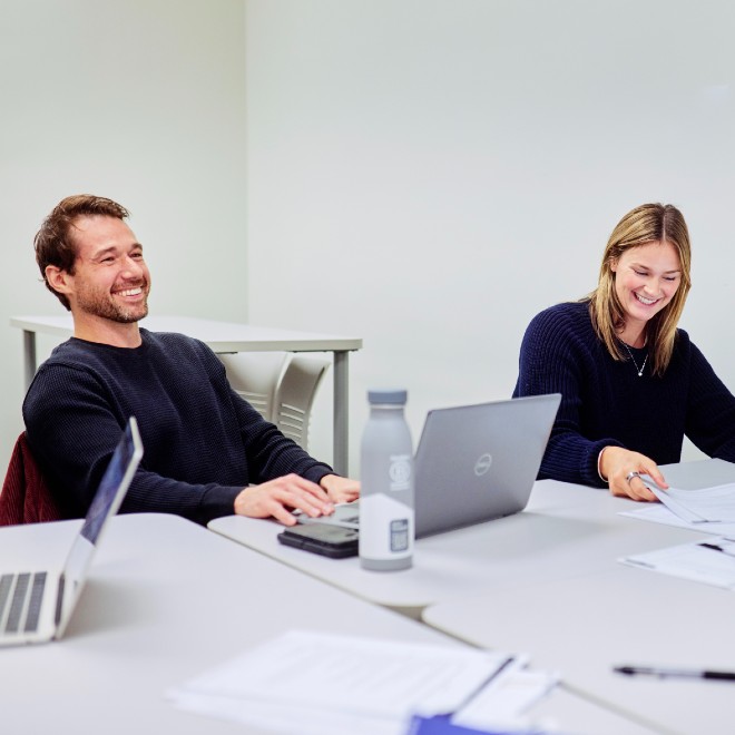 Two students sitting in a classroom