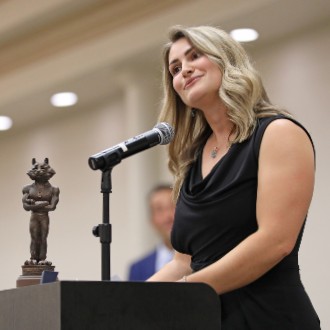 Nicole Kirk's achievements in track and field led her to the podium at the 2024 Husky Hall of Fame induction ceremony.