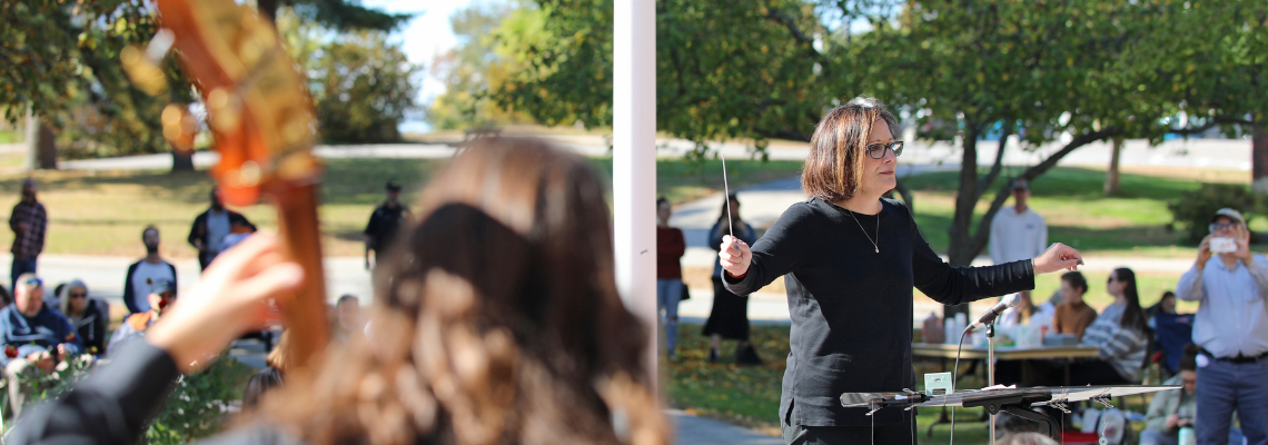 President Edmondson conducting the band during Homecoming 2024