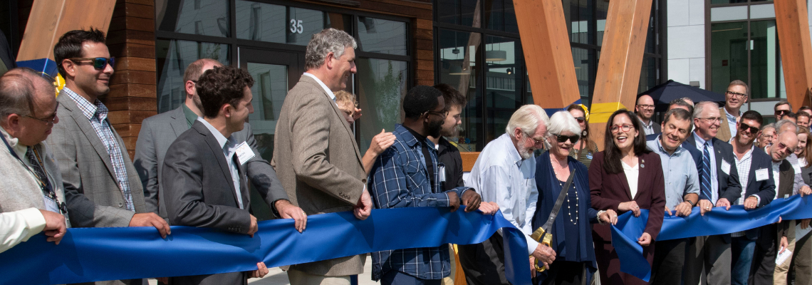 ribbon cutting in front of the McGoldrick Center, USM