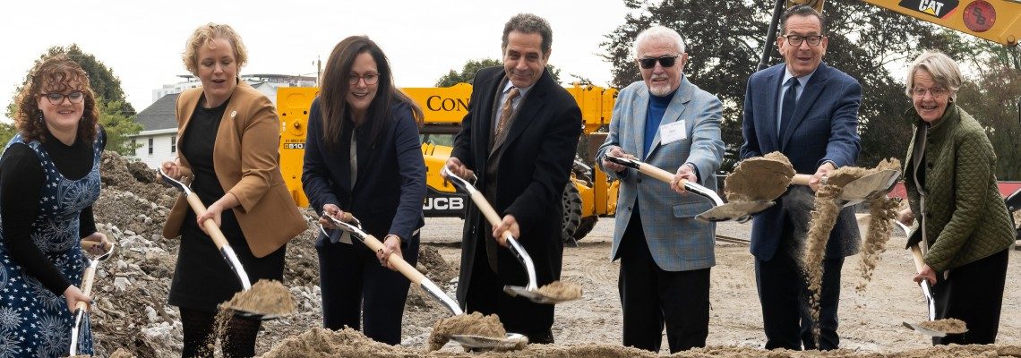 Groundbreaking group with shovels