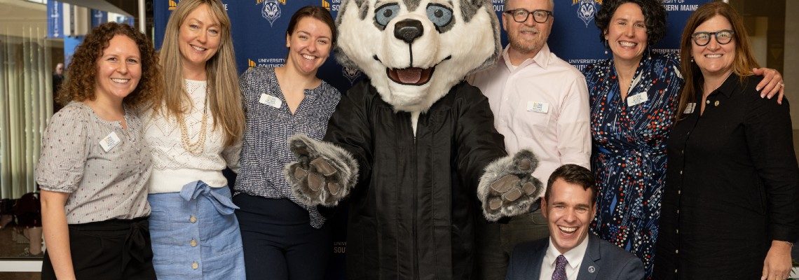 Foundation staff with Champ at Commencement photo booth